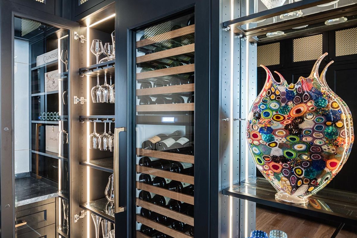 Elegant wine storage area with glass-front cabinets and colorful decor