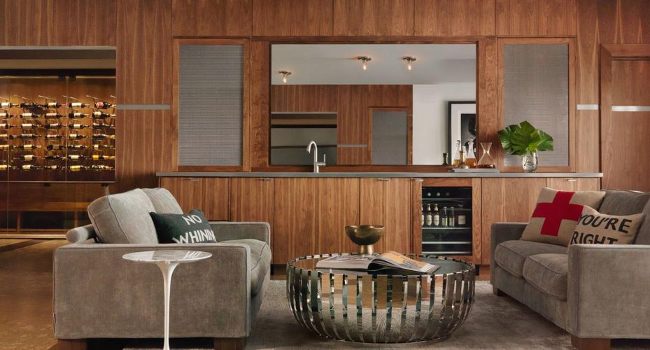 A hidden Seura mirror TV revealing a scenic landscape in a sophisticated bar area.